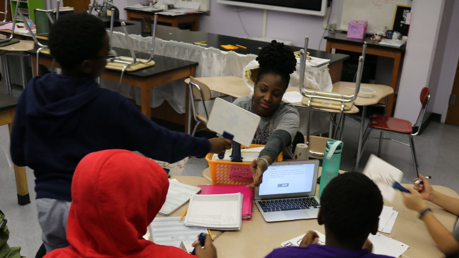 West Prep science teacher Tunisia Bristol quizzes sixth graders during after-school tutoring. The Upper West Side school in District 3 has had to pay for the after school program after the organization that had been running it was shut down amid a struggle to get staffers' background checks cleared.