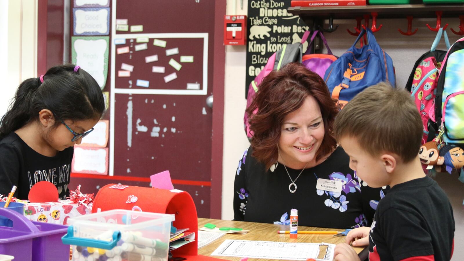 Kristin Golden, principal of Riverdale Elementary School in Thornton, talks with students.