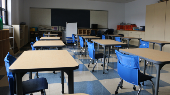 empty desks in an empty classroom