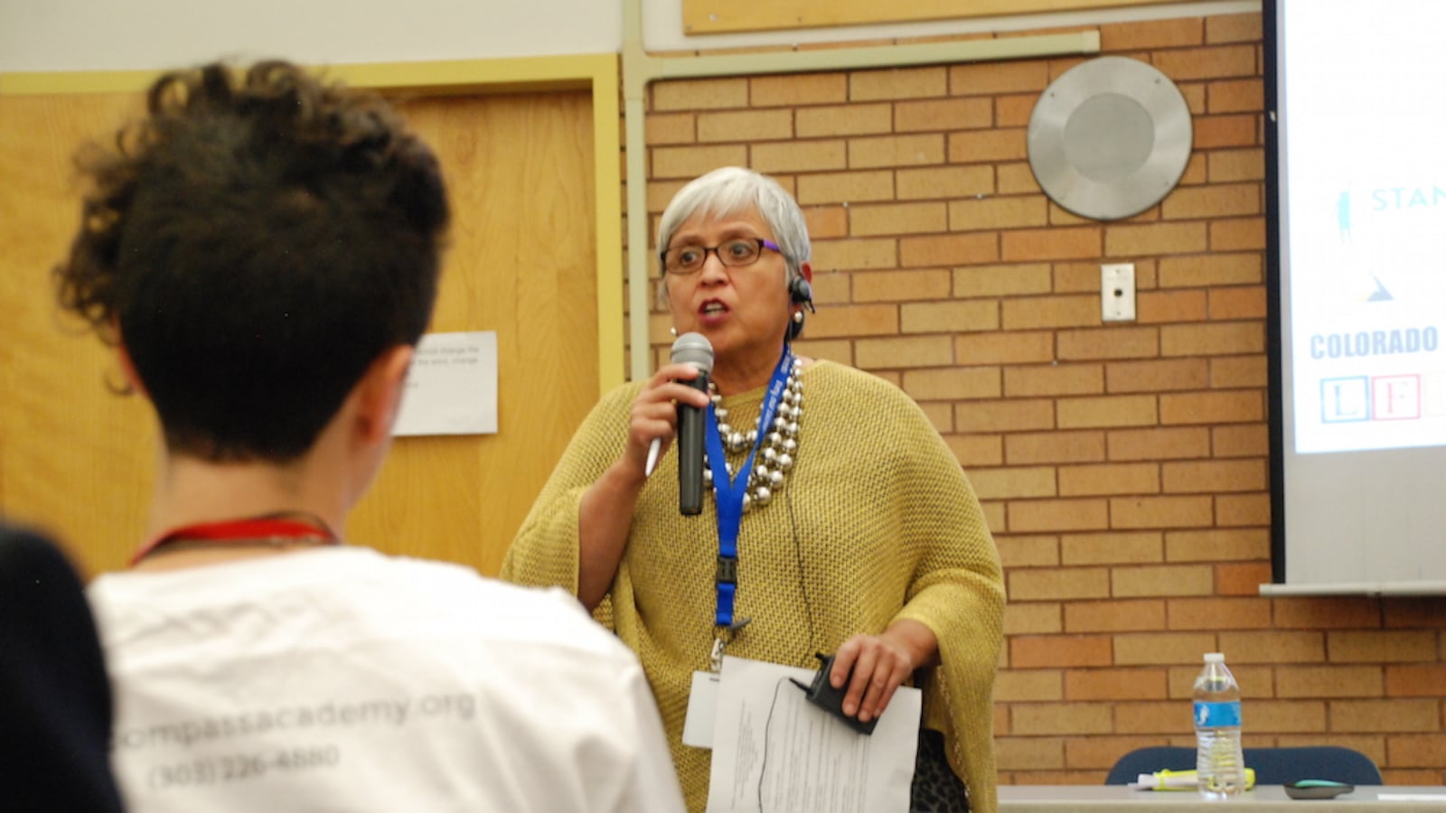Board member Rosemary Rodriguez speaks at Abraham Lincoln High (Chalkbeat file)