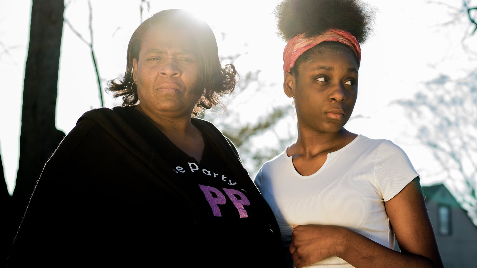 Angela Grier and her daughter, Marnina Grier, 13, who is transitioning into freshman year of high school, pose for a portrait outside their home in Dolton. Feb. 3rd, 2021.