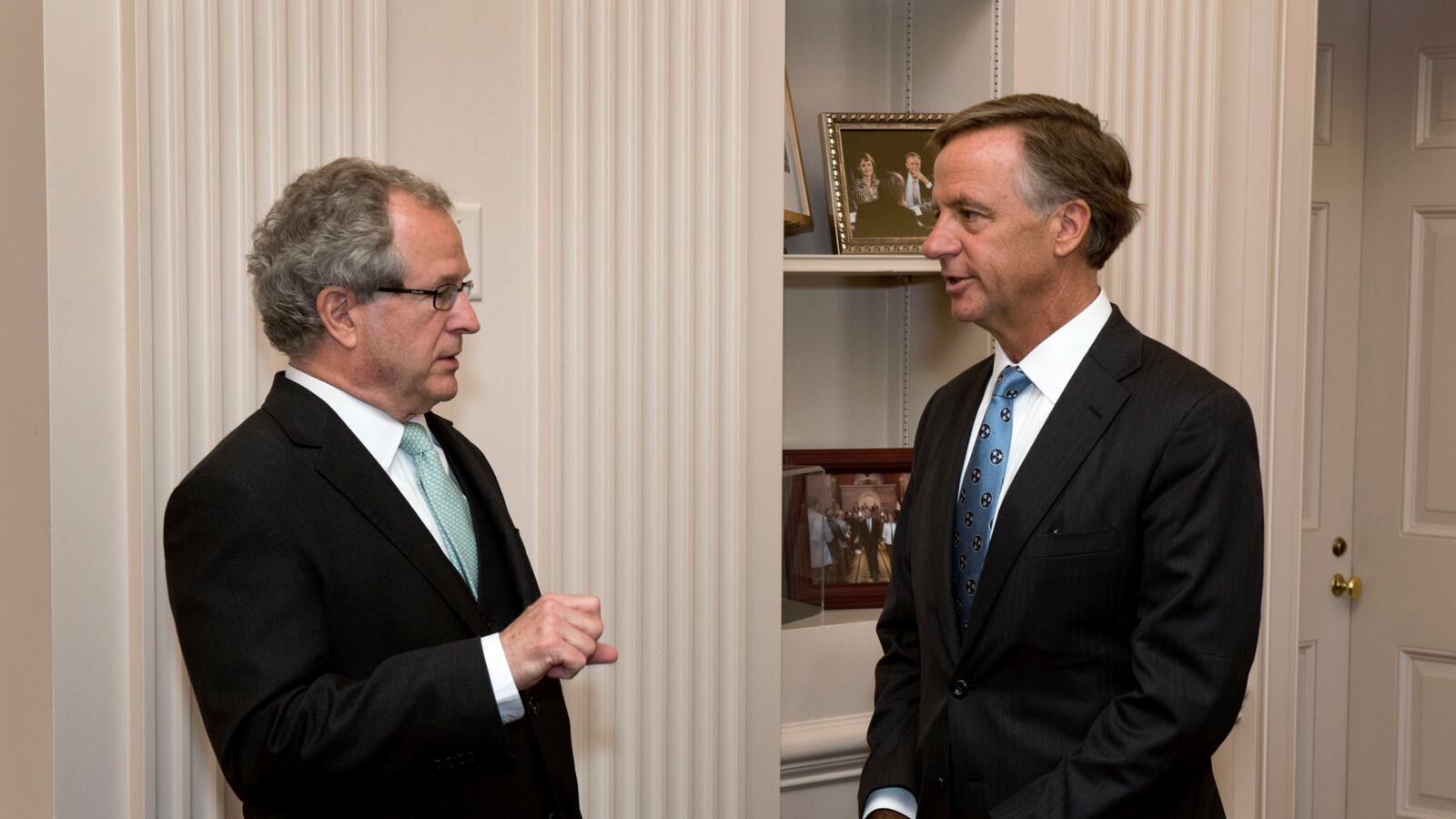 From left: Rep. Mark White of Memphis speaks with Gov. Bill Haslam at a bill-signing ceremony at the State Capitol.