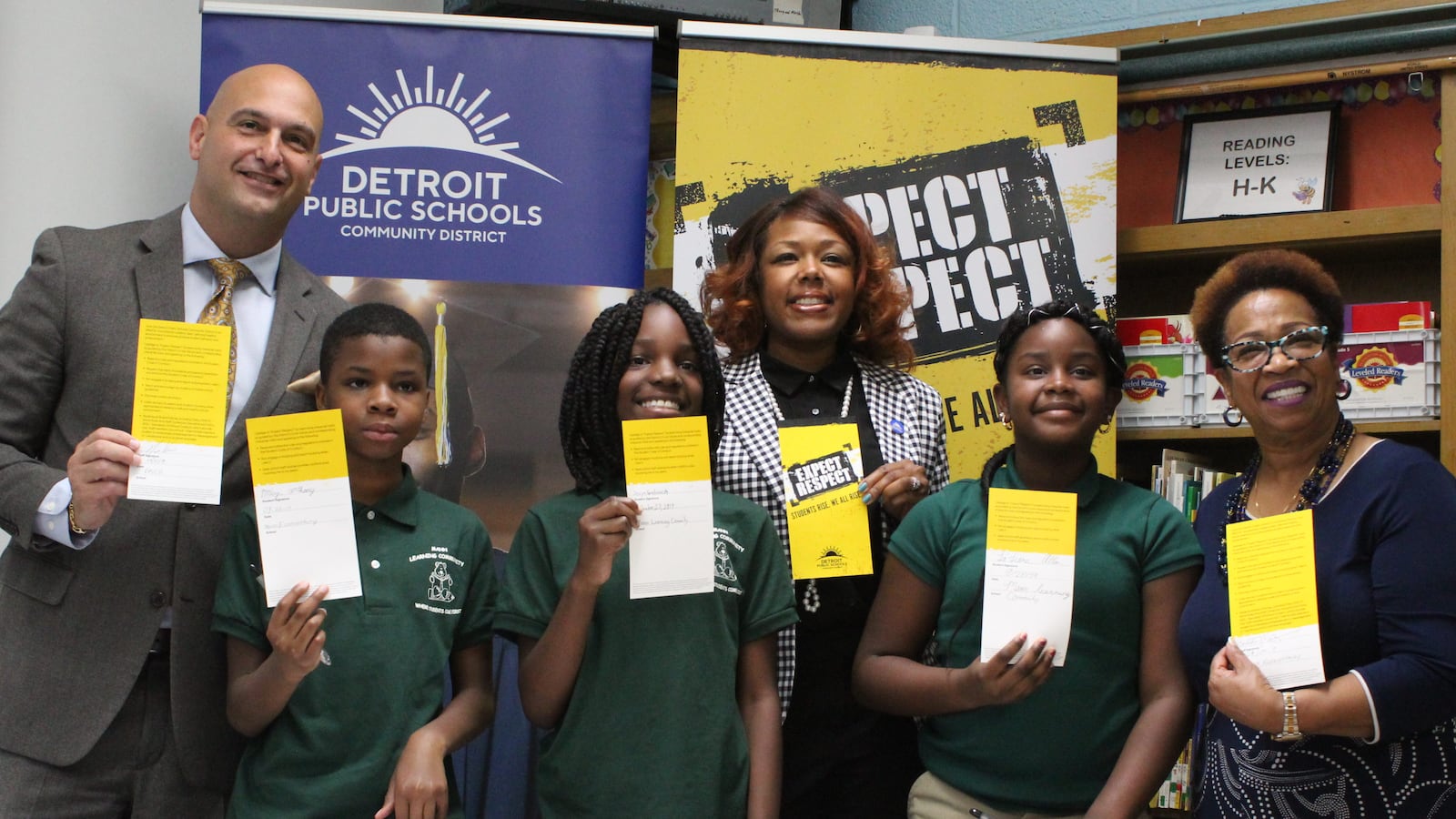Superintendent Nikolai Vitti (left), and board members Angelique Peterson-Mayberry and Corletta Vaughn (back left and right), signed the Detroit district's new anti-bullying pledge alongside students at Mann Learning Community.
