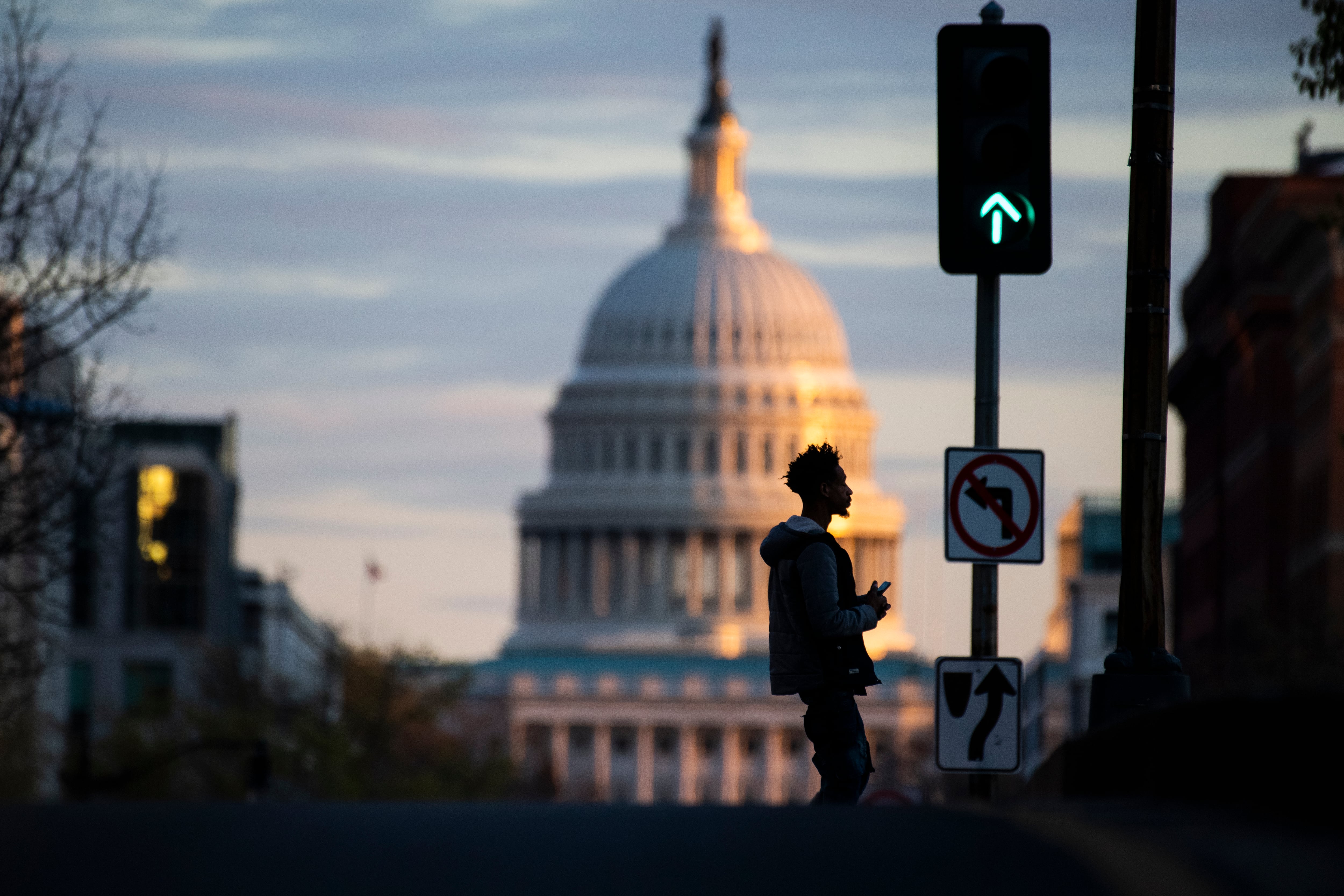 A man walks in front of the U.S. Capitol building during the coronavirus outbreak in April 2020.