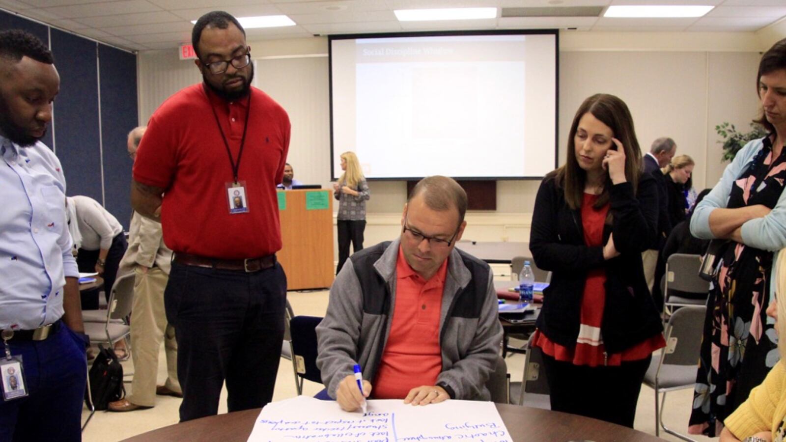 Shelby County educators list their reactions to students who act out as part of a discipline training on using restorative justice techniques in the classroom.