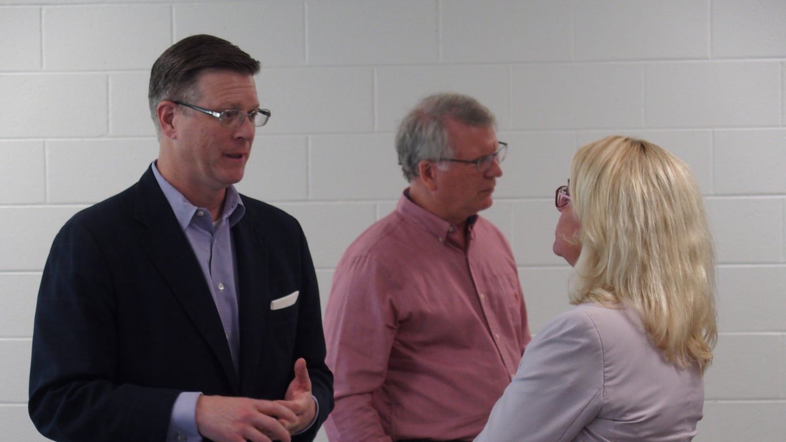 Signal Mountain Mayor Chris Howley speaks with Valerie Speakman, general counsel for Arlington Community Schools, during three days of discussions with leaders of Shelby County's suburban school systems.