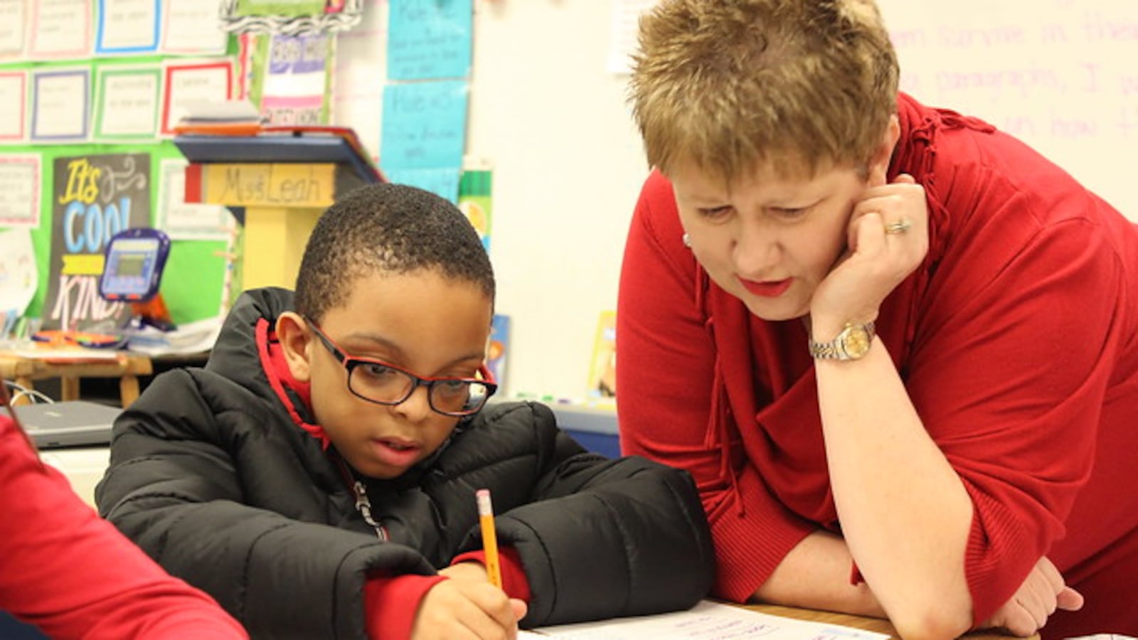 A Tennessee teacher works with a student.