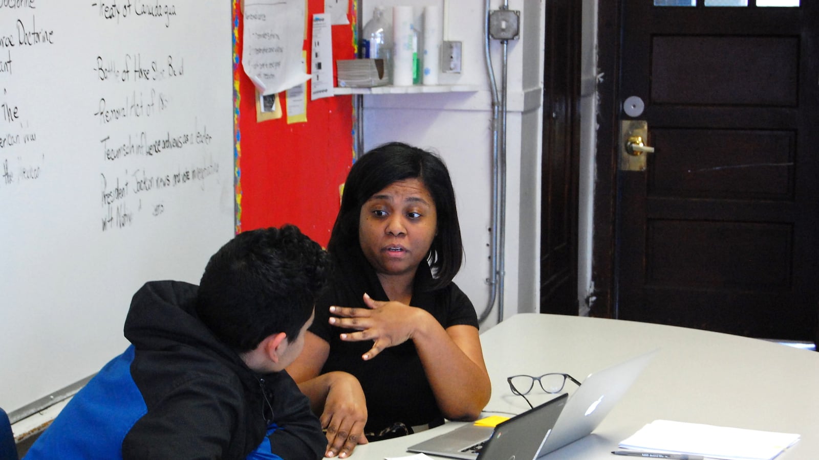 Eighth-grade teacher Traci McCullough meets one-on-one with a student in February 2020 as part of a mentoring session at Chicago International Charter School Bucktown, an early adopter of the Summit Learning program.