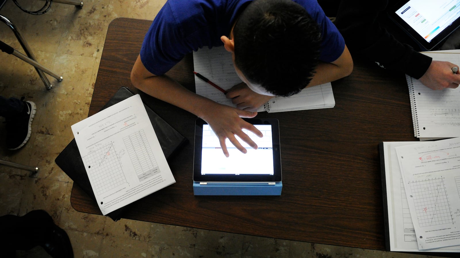 Grant Beacon Middle School student Jeriah Garcia works out an algebra problem on his school-supplied tablet in 2012.