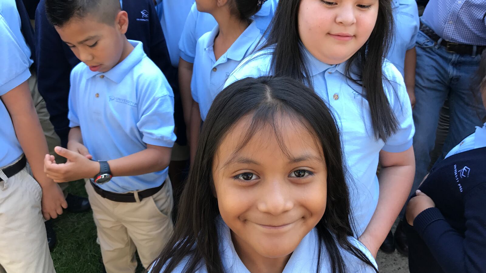 A student at University Prep Steele Street in Denver smiles at a celebration of the school's test scores in August 2017.