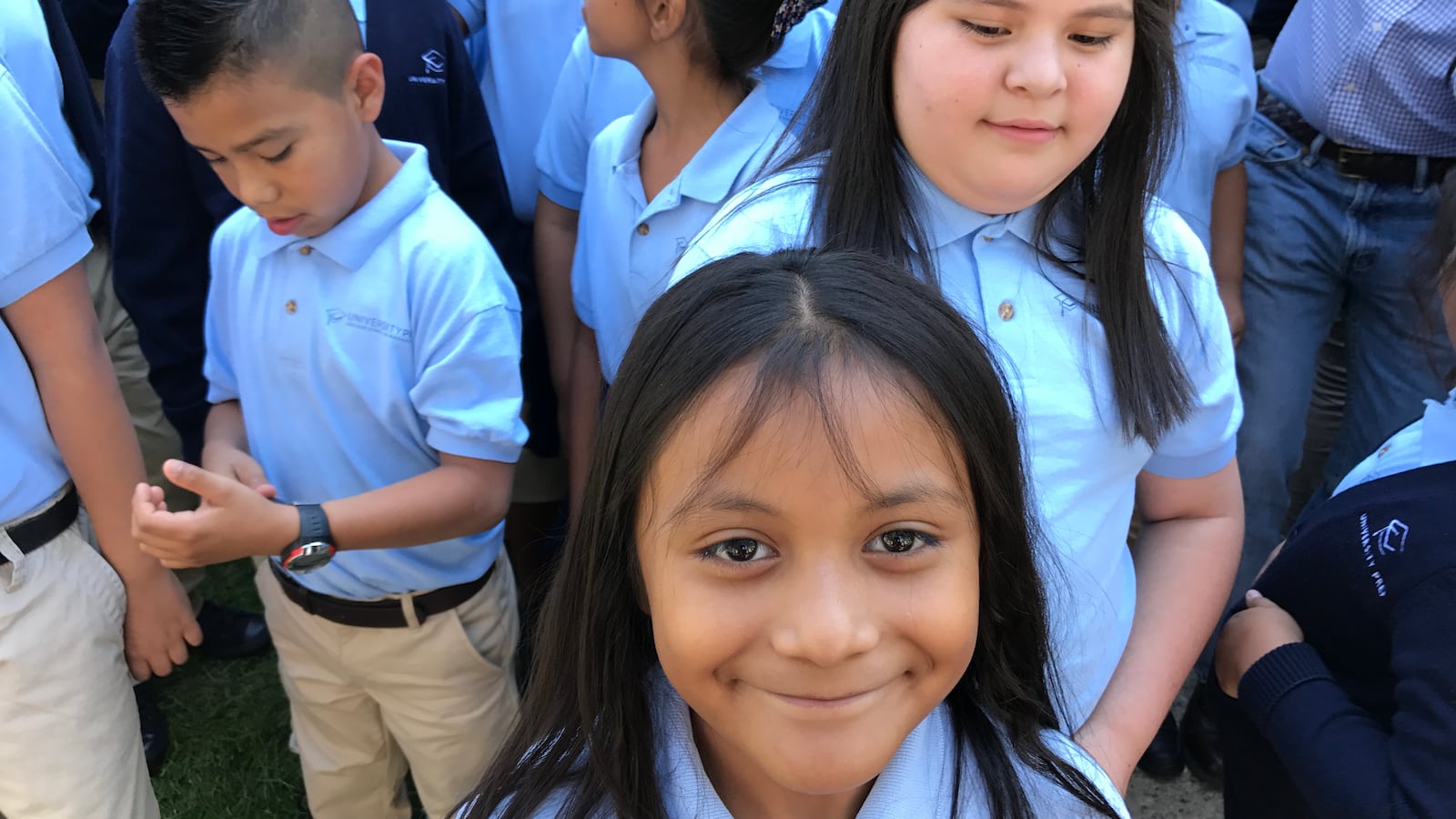 A student at University Prep Steele Street in Denver smiles at a celebration of the school's test scores in August 2017.