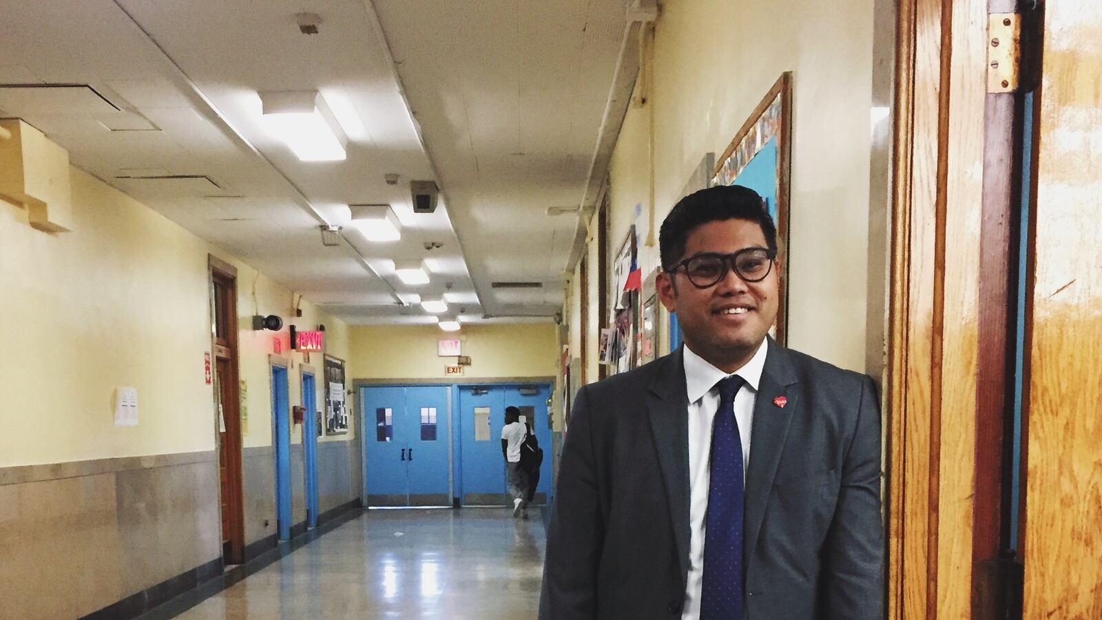Principal Carl Manalo in the hallway of QIRT