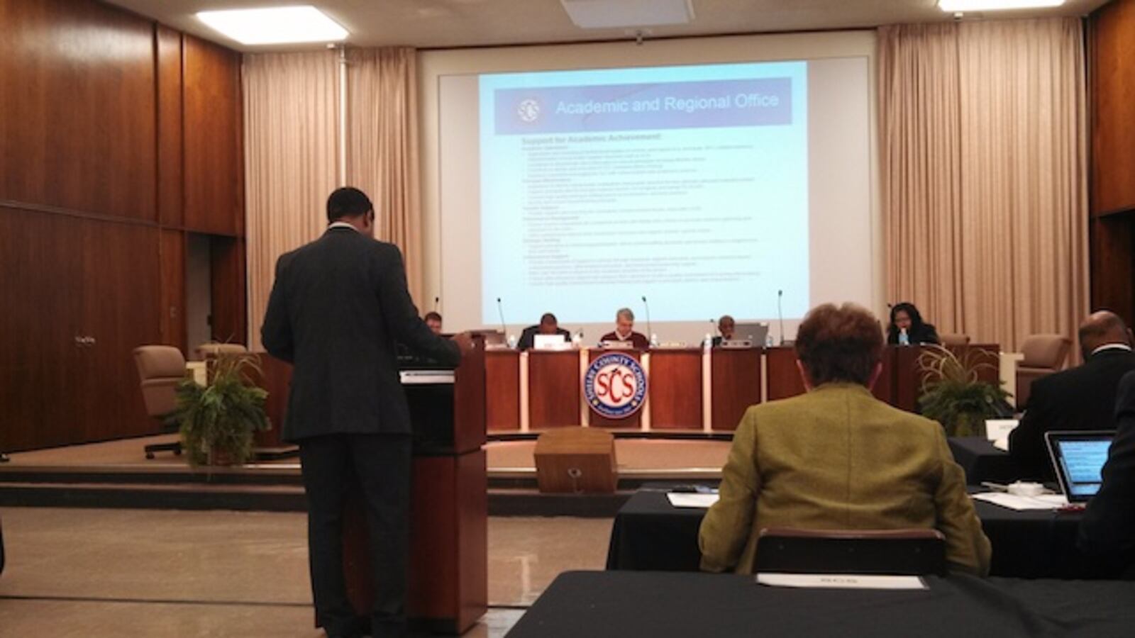 SCS Chief Academic Officer Roderick Richmond presents his department's plans for budget cuts and spending.