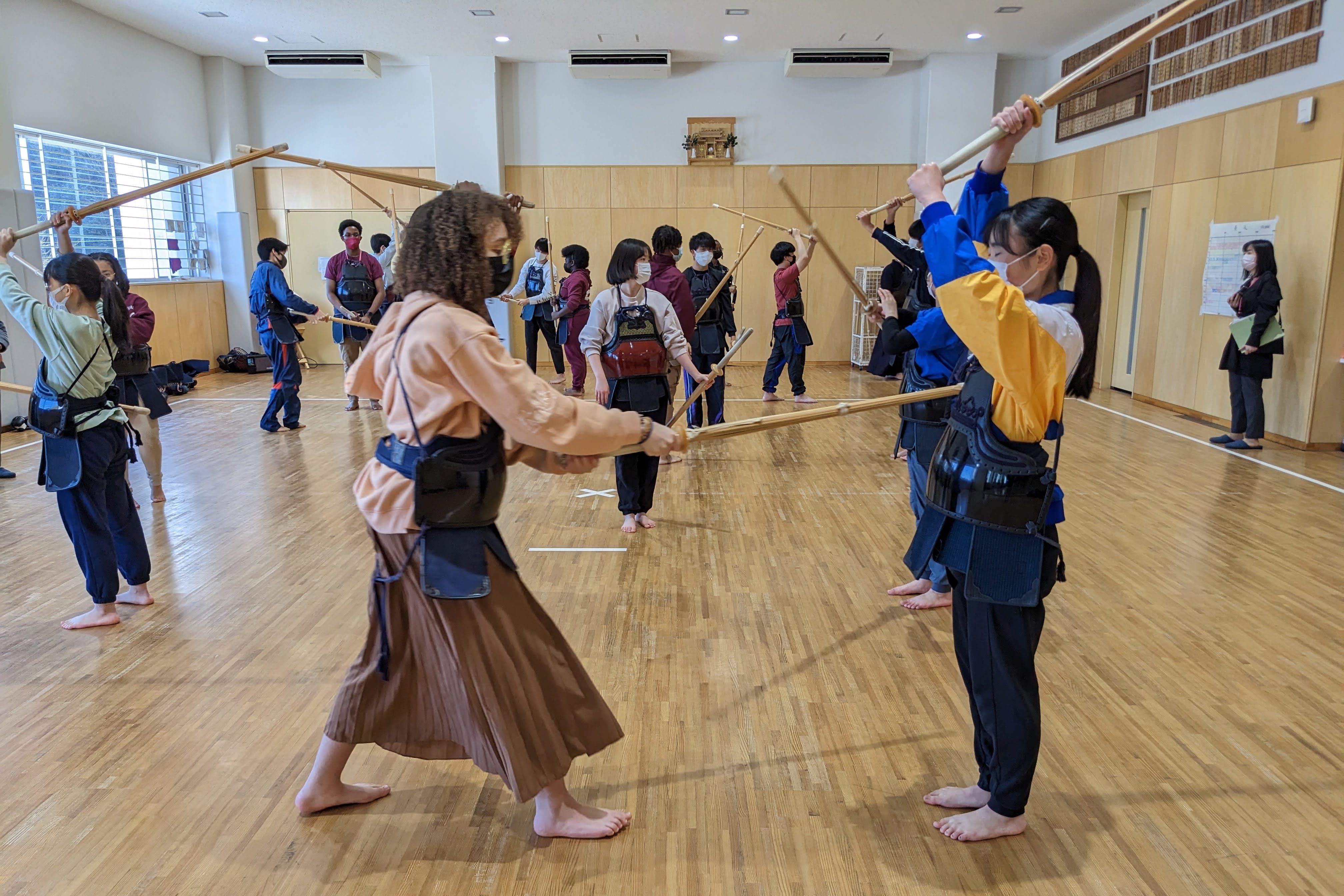 Two high school students practice kendo.