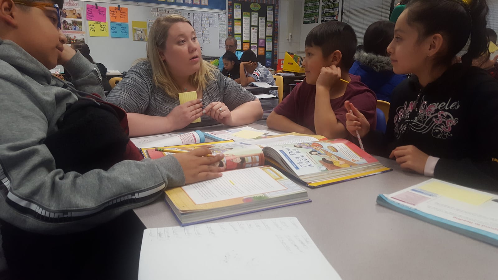 Fifth grade teacher Haley Stratton, talks with her students at Rose Hill Elementary in Adams 14.