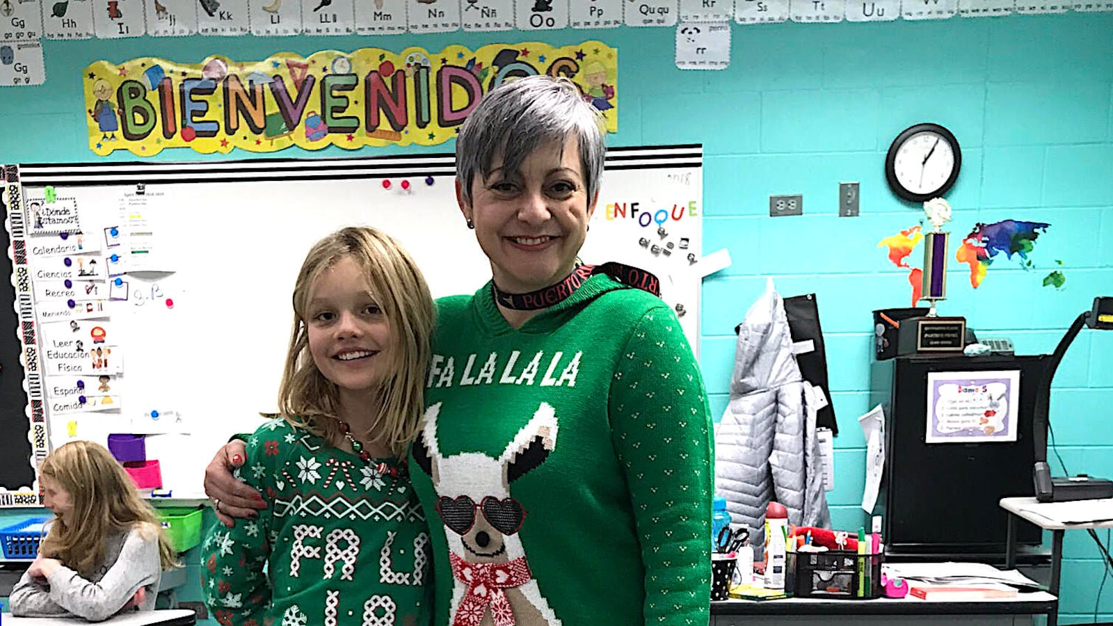 Yesenia Perez-Mercado, a third-grade teacher at Cottonwood Plains Elementary Schools, stands with a student.