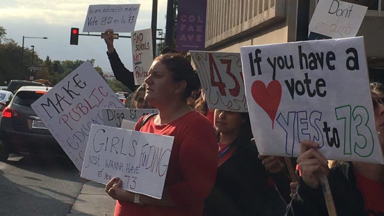 Denver teachers line Colfax Avenue to urge voters to approve Amendment 73, a tax increase to raise money for education.