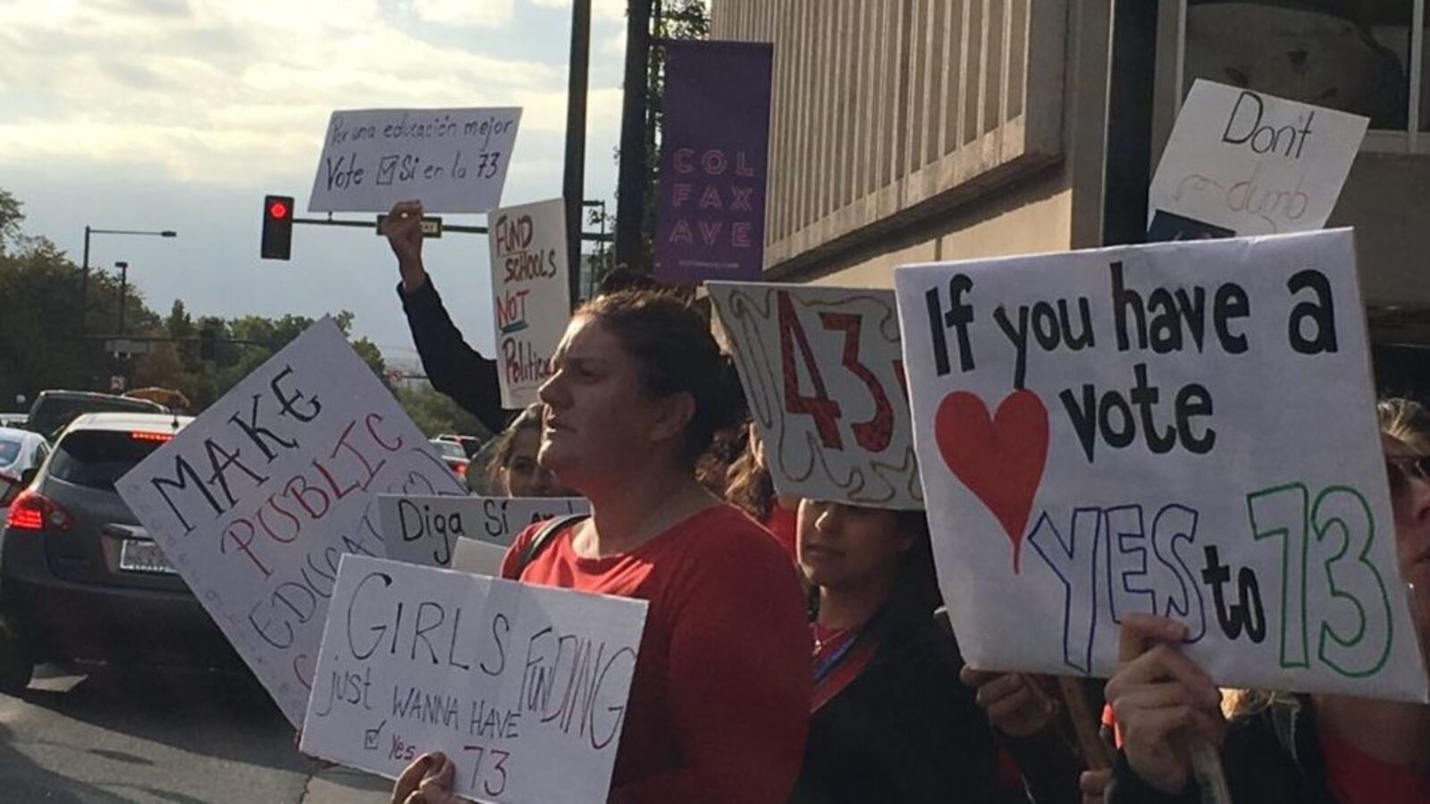 Denver teachers line Colfax Avenue to urge voters to approve Amendment 73, a tax increase to raise money for education.