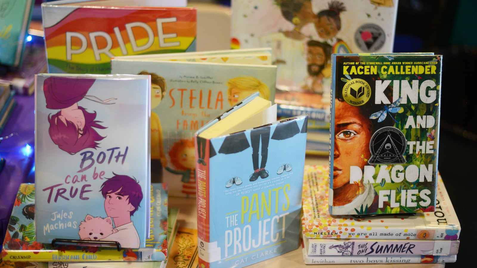 Children’s books about LGBTQ+ issues sit on a shelf.