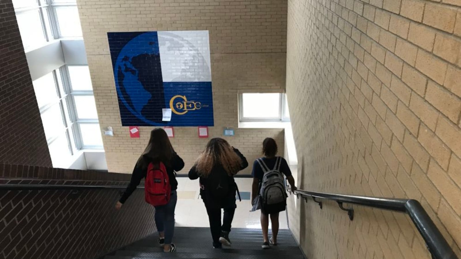 Students walk down a staircase at Denver's CEC Early College.