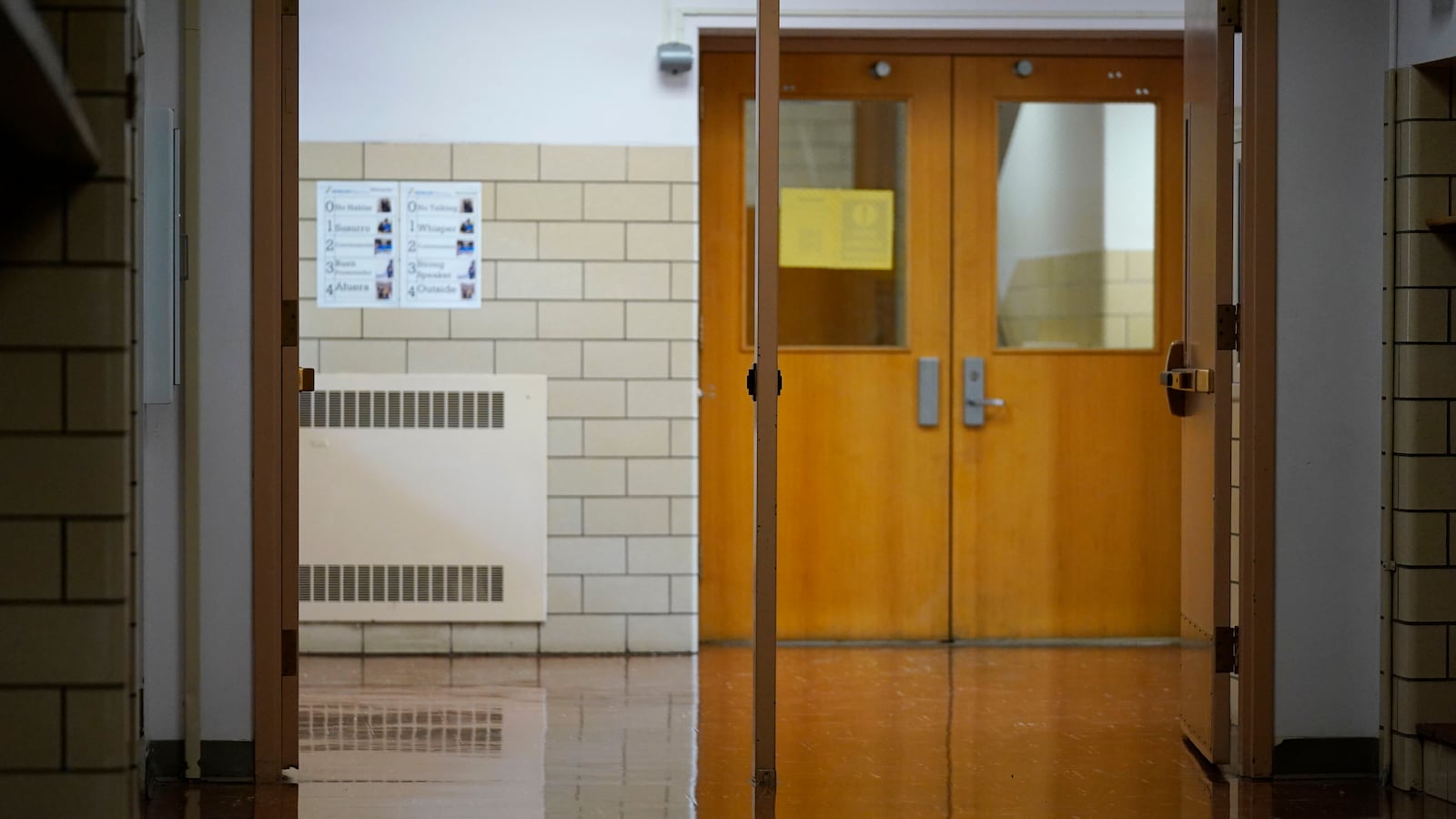 Empty school hallway and door.