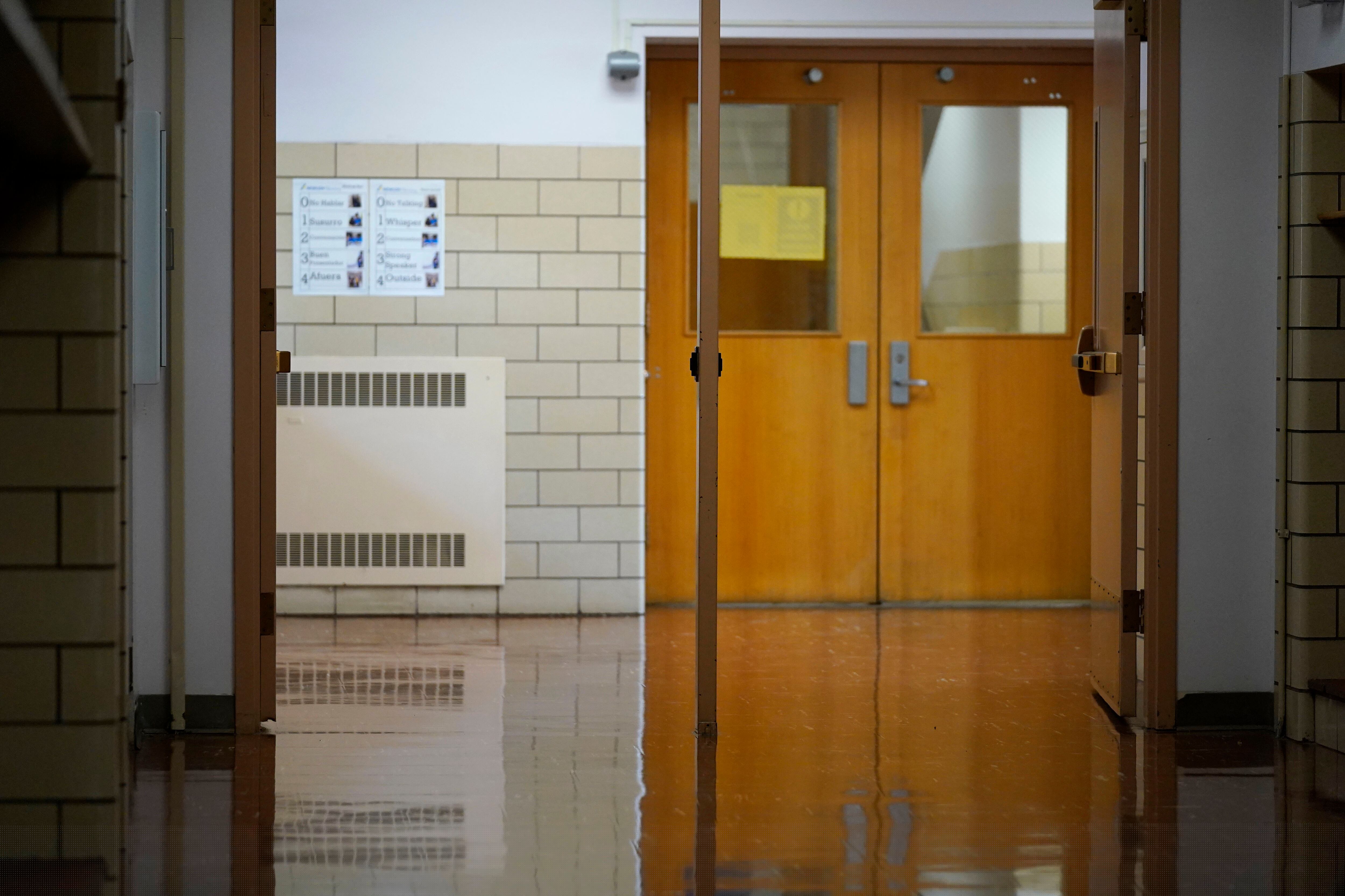 Empty school hallway and door.