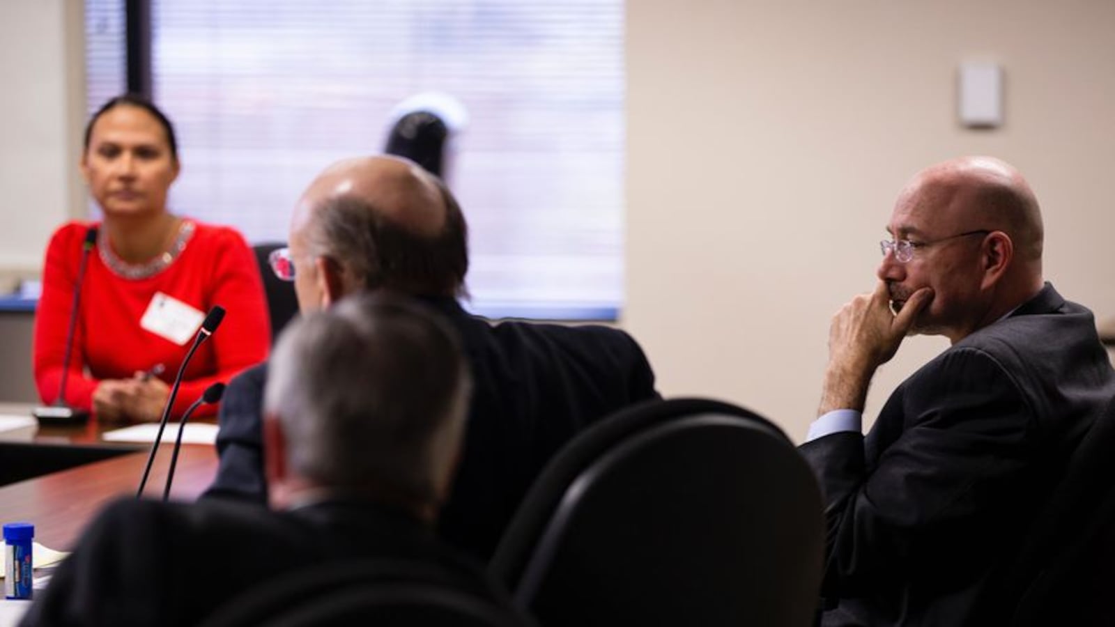 Mike Feinberg, right, sits with his lawyers, Christopher L. Tritico, left, and Ron S. Rainey while a former KIPP employee testifies during a hearing on Feb. 12, 2020. Feinberg, a co-founder of KIPP, was dismissed in 2018 after a sexual misconduct investigation. Eddie Gaspar/The Texas Tribune