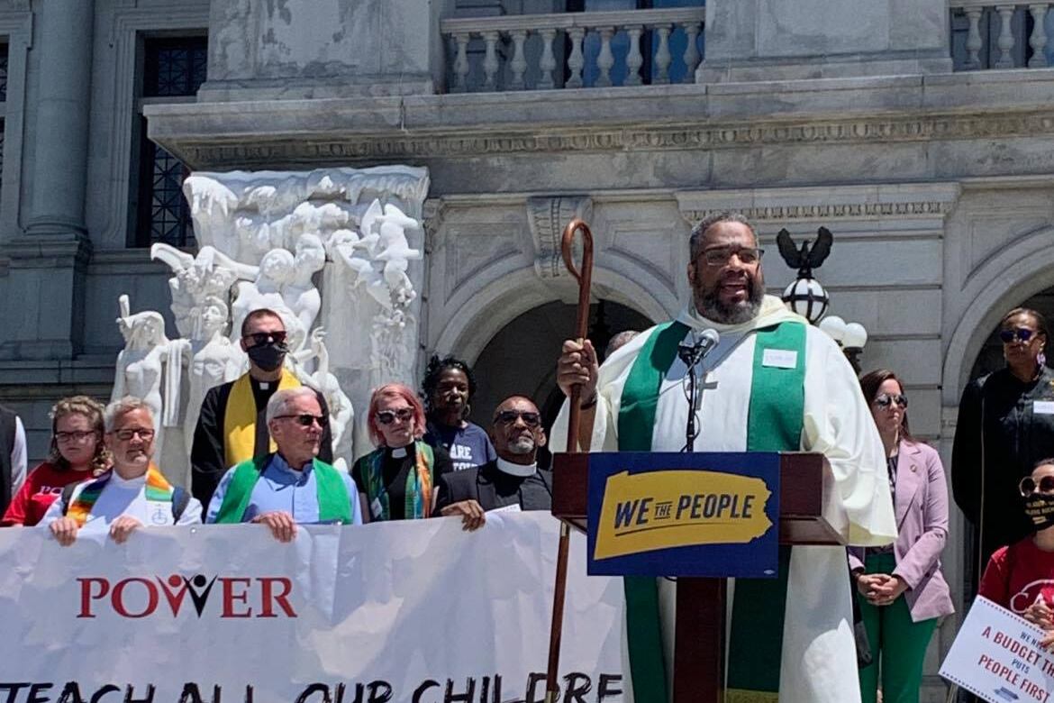 Rev. Dwayne Royster leads a rally on fair education funding at the state capitol building last month.