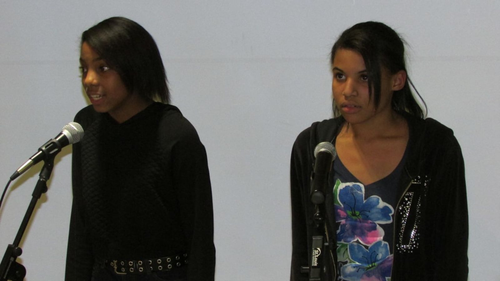 Madyson Jones (left) and Madison Ivory of Lawrence Township's Belzer Middle School present a co-written poem at an Indy Pulse competition last week at Donnan Middle School. Ivory, who uses just her last name when she performs, took first place for a different poem in the contest.