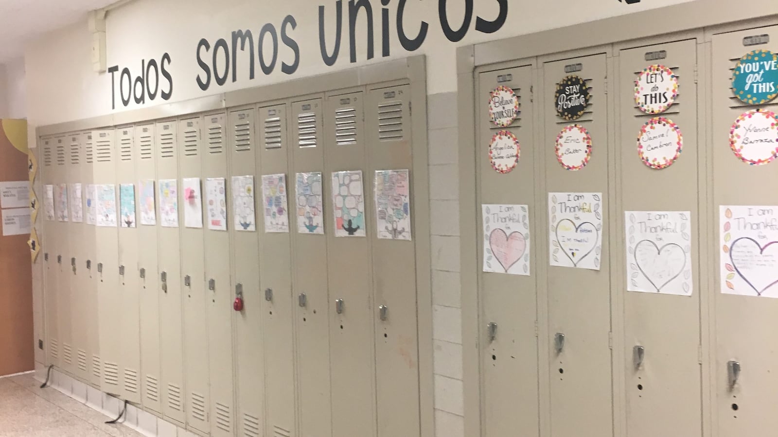 A messaging saying 'we are all unique' adorns a hallway at Belmont-Cragin Elementary, a dual-language school.