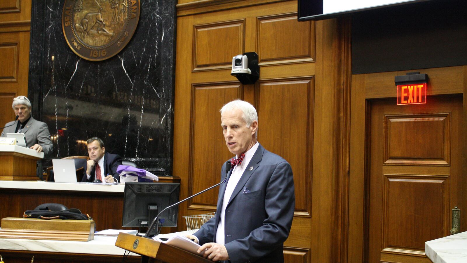 Rep. Bob Behning, R-Indianapolis, chairman of the House Education Committee, stands at the podium in the Indiana General Assembly.