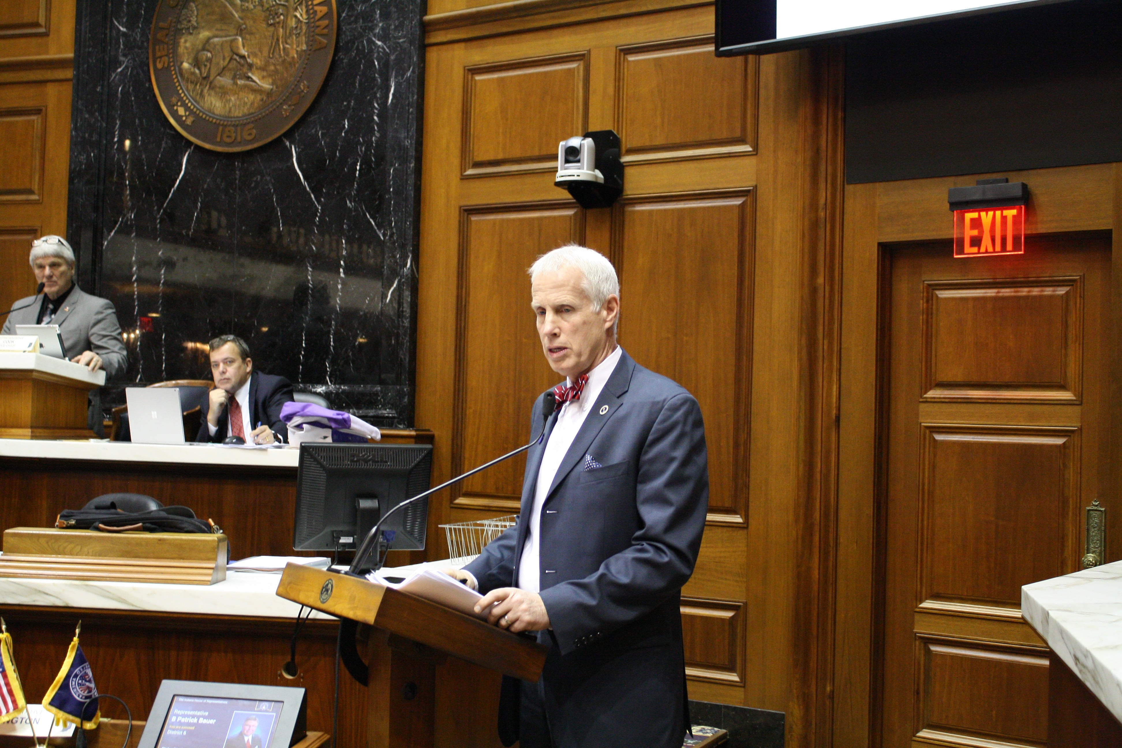 Rep. Bob Behning, R-Indianapolis, chairman of the House Education Committee, stands at the podium in the Indiana General Assembly.