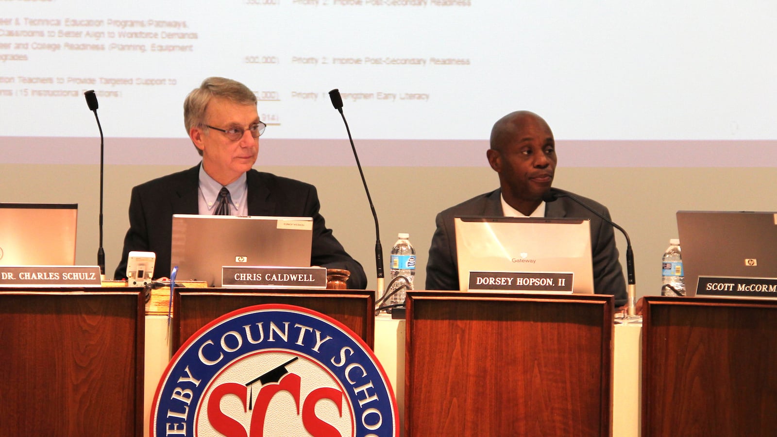 Board member Chris Caldwell and Superintendent Dorsey Hopson listen to a budget presentation in 2015.