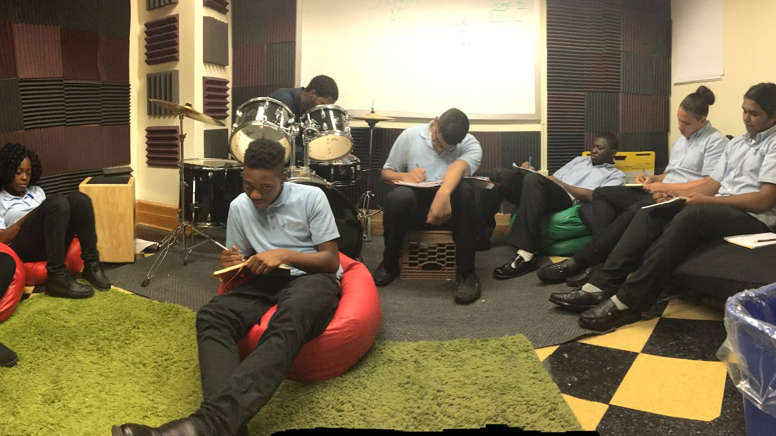 Students work on a writing assignment in Ian Levy's class.