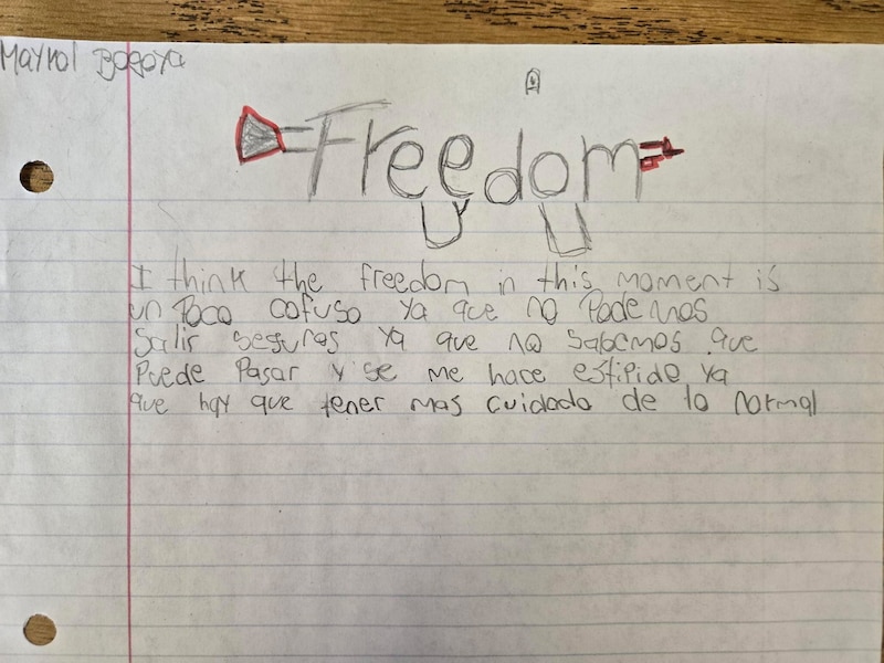 Writing on a lined notebook page.