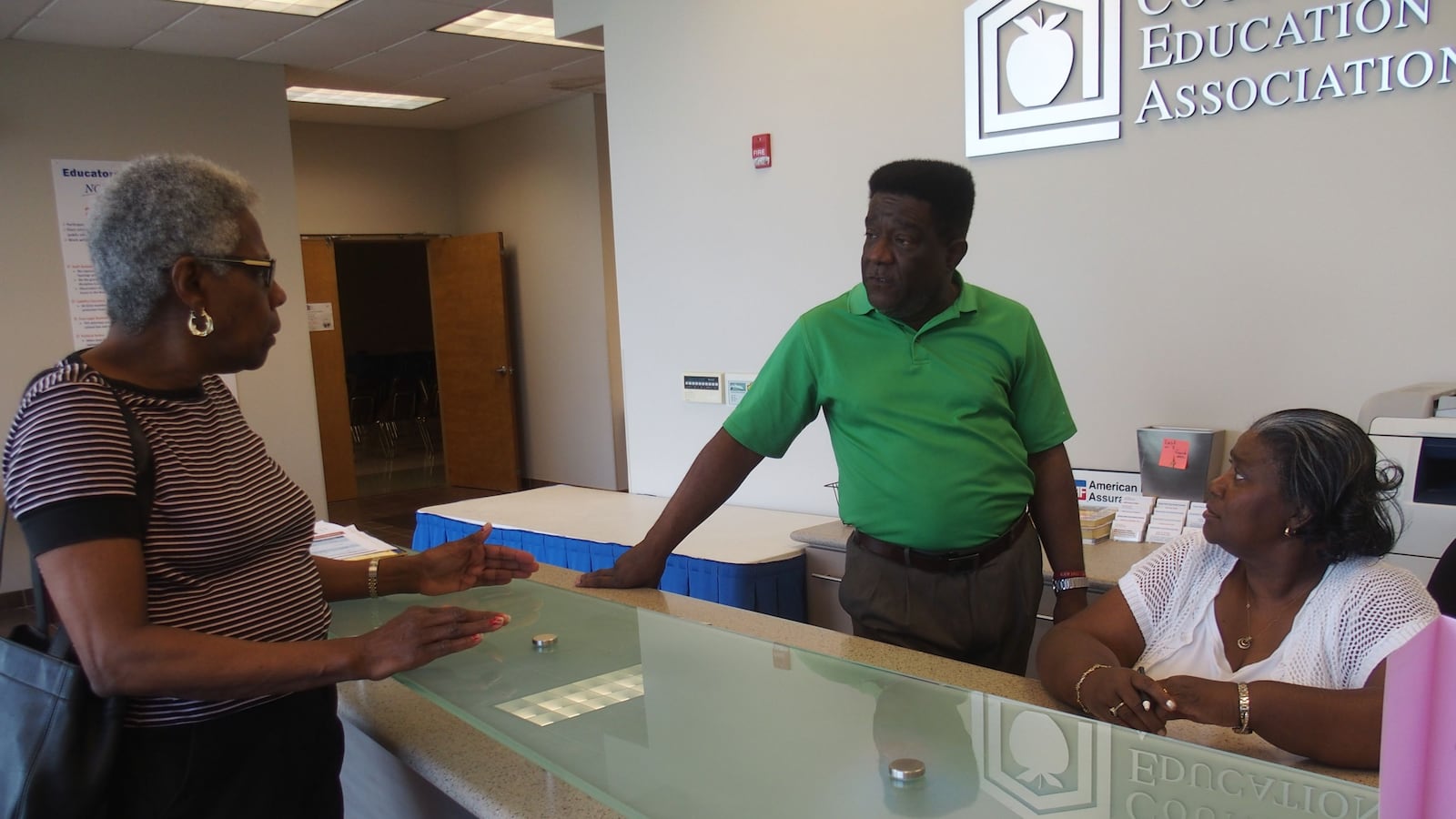 From left: Daisy Cleaves, president of Shelby County's Retired Teachers Association, discusses retirement benefits with teachers union president Keith Williams and retiree LaVerne Dickerson.
