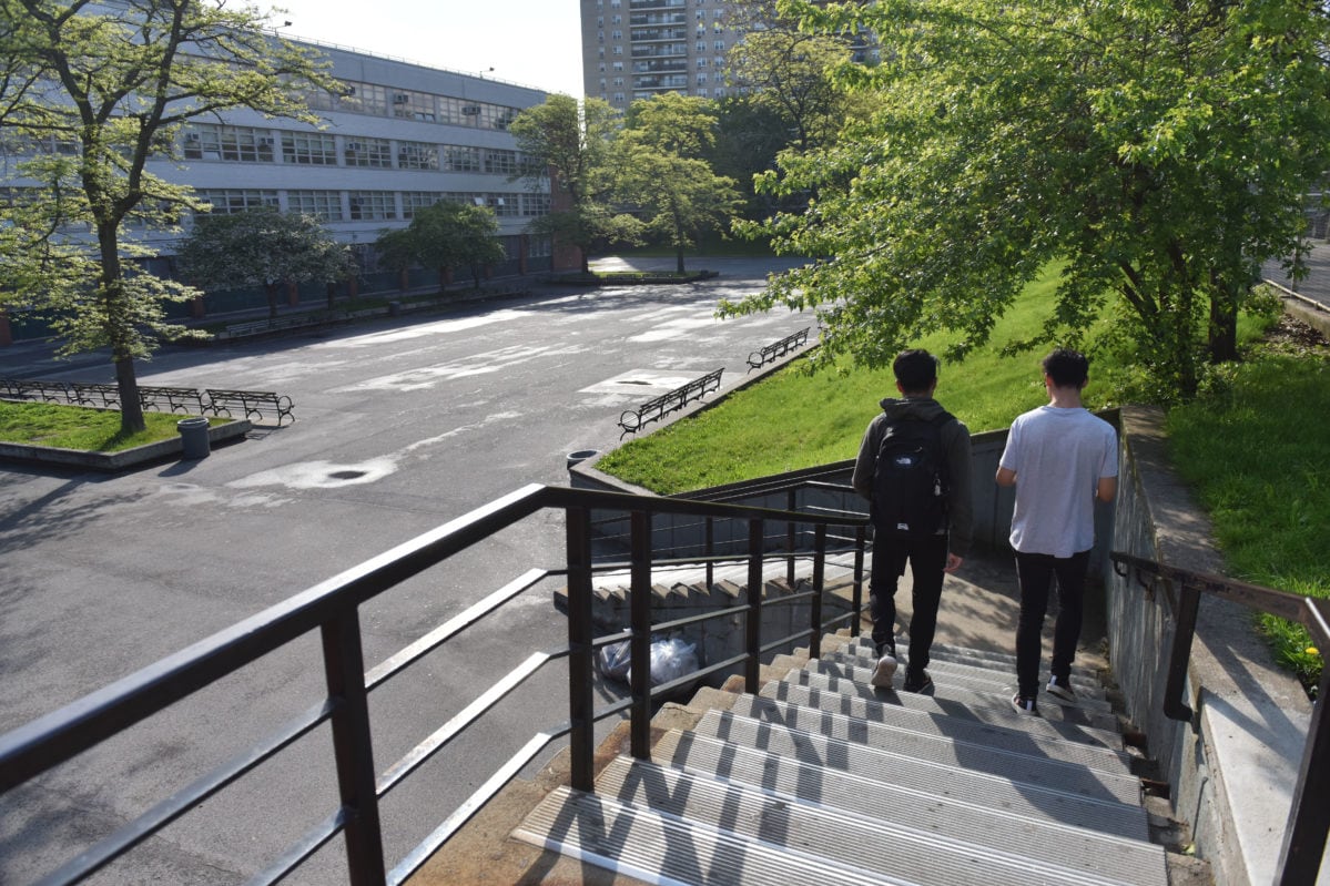 Students walk down the stairs near Bronx High School of Science, a specialized high school in the Bronx.