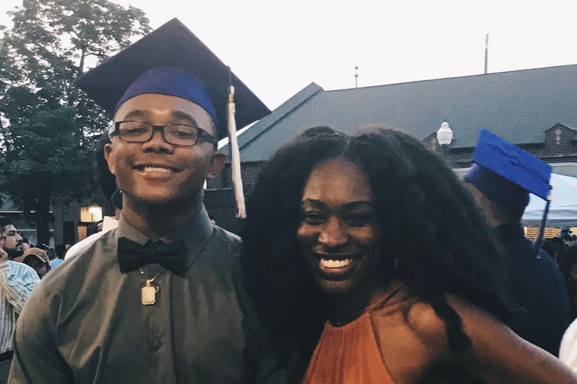 Reporter Aaricka Washington, right, poses with her 19-year-old brother LJ in cap and gown after his high school graduation.