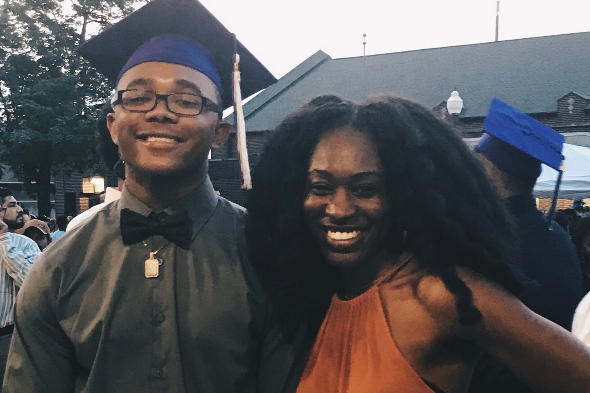 Reporter Aaricka Washington, right, poses with her 19-year-old brother LJ in cap and gown after his high school graduation.