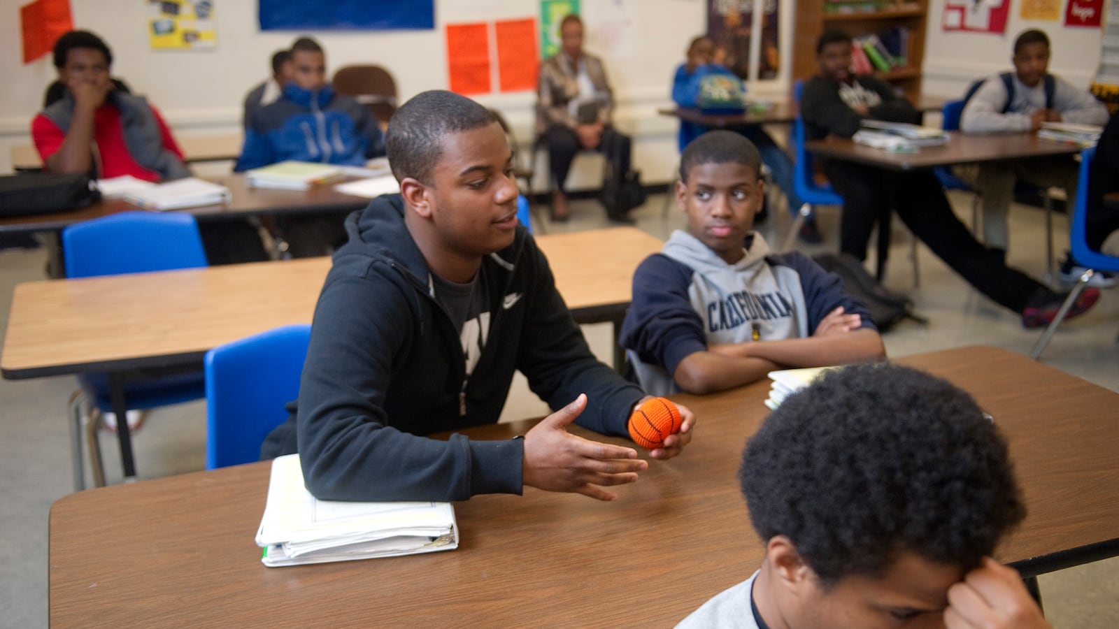 Oakland High School 10th grader, Barry Williams, answers a question from instructor Tiago Robinson during the Manhood Development Program, which is part of the district's African-American Male Achievement initiative. (Photo by Ann Hermes/The Christian Science Monitor via Getty Images)