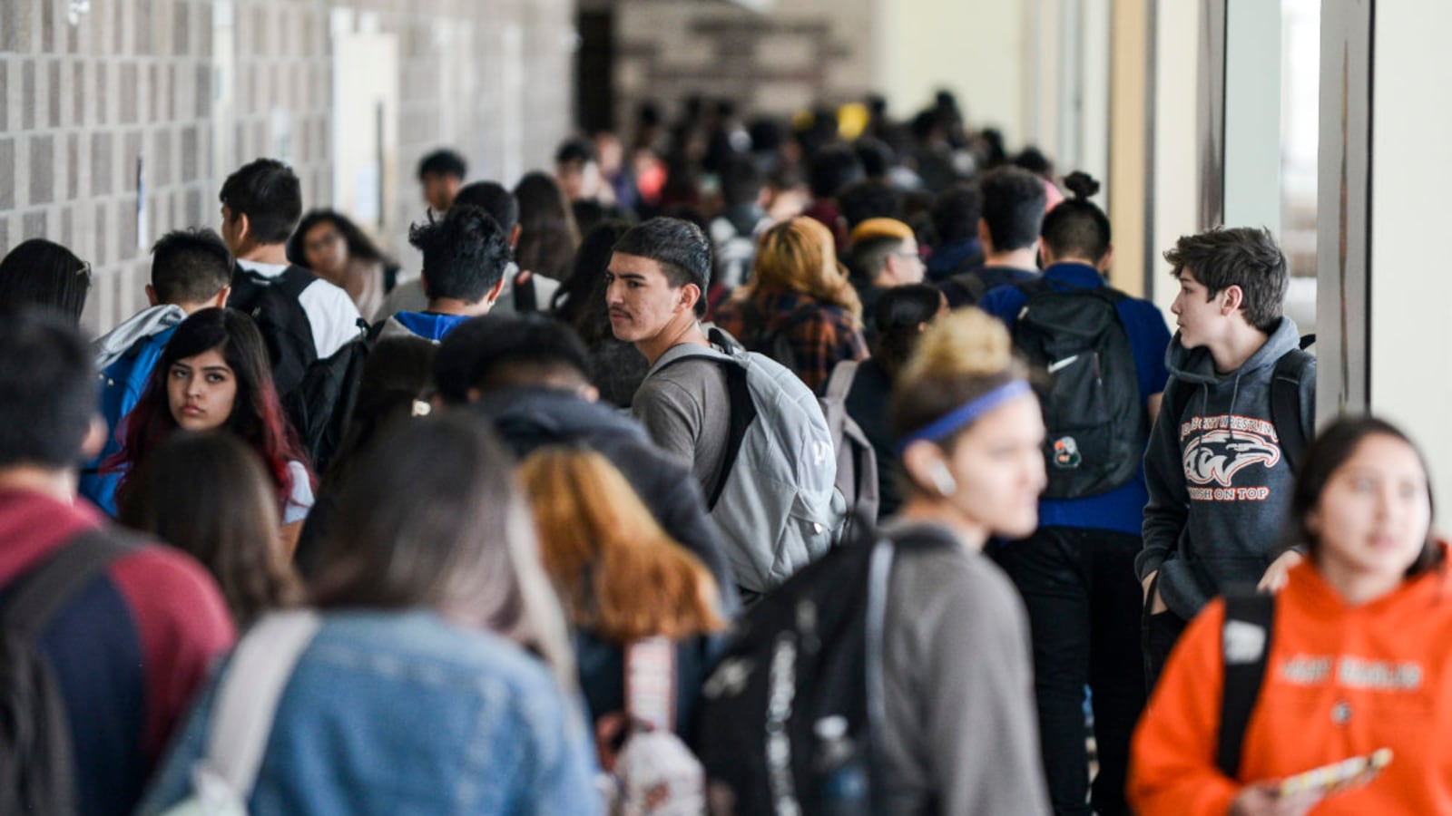 Students walks through the hall at Adams City High School between classes Monday, Feb. 4, 2019 in Commerce City.
