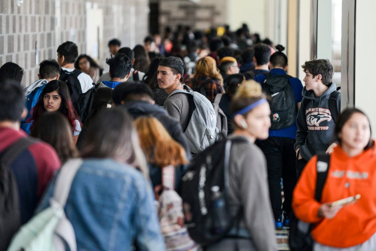 Students walks through the hall at Adams City High School between classes Monday, Feb. 4, 2019 in Commerce City.