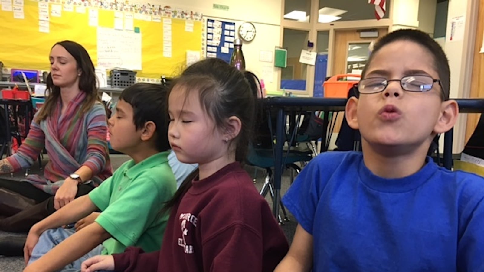 First-graders at Denver's Munroe Elementary do a mindfulness exercise led by school psychologist Amy Schirm.