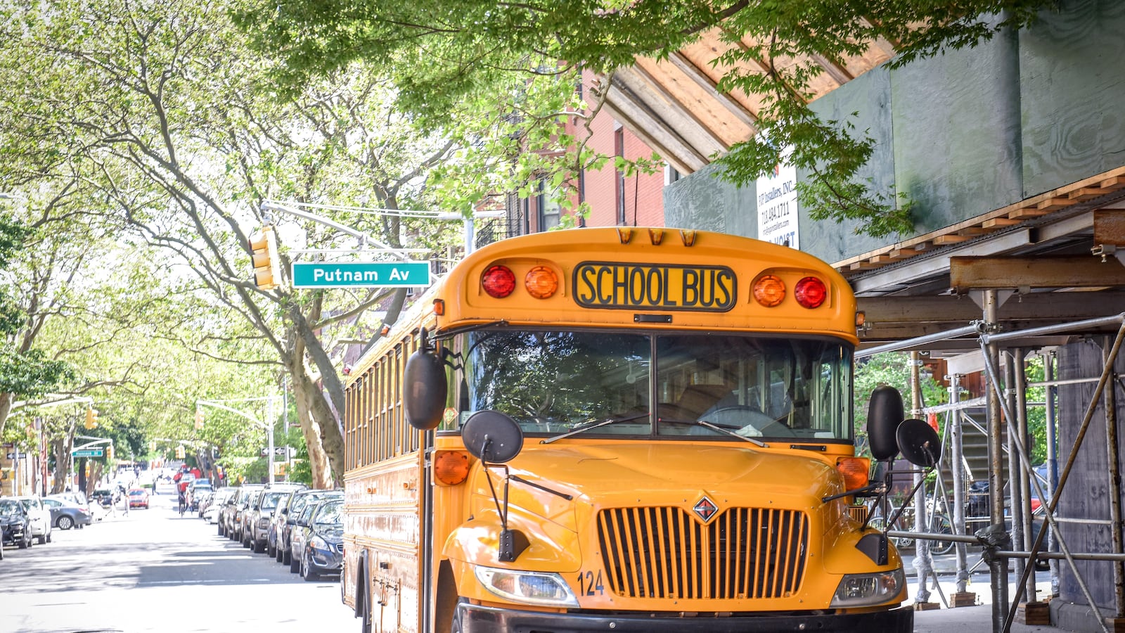 School bus outside Uncommon Schools Brooklyn East Collegiate Charter School, at 832 Marcy Ave., in Crown Heights, Brooklyn. Photo by David Handschuh/Chalkbeat; Taken May, 2019
