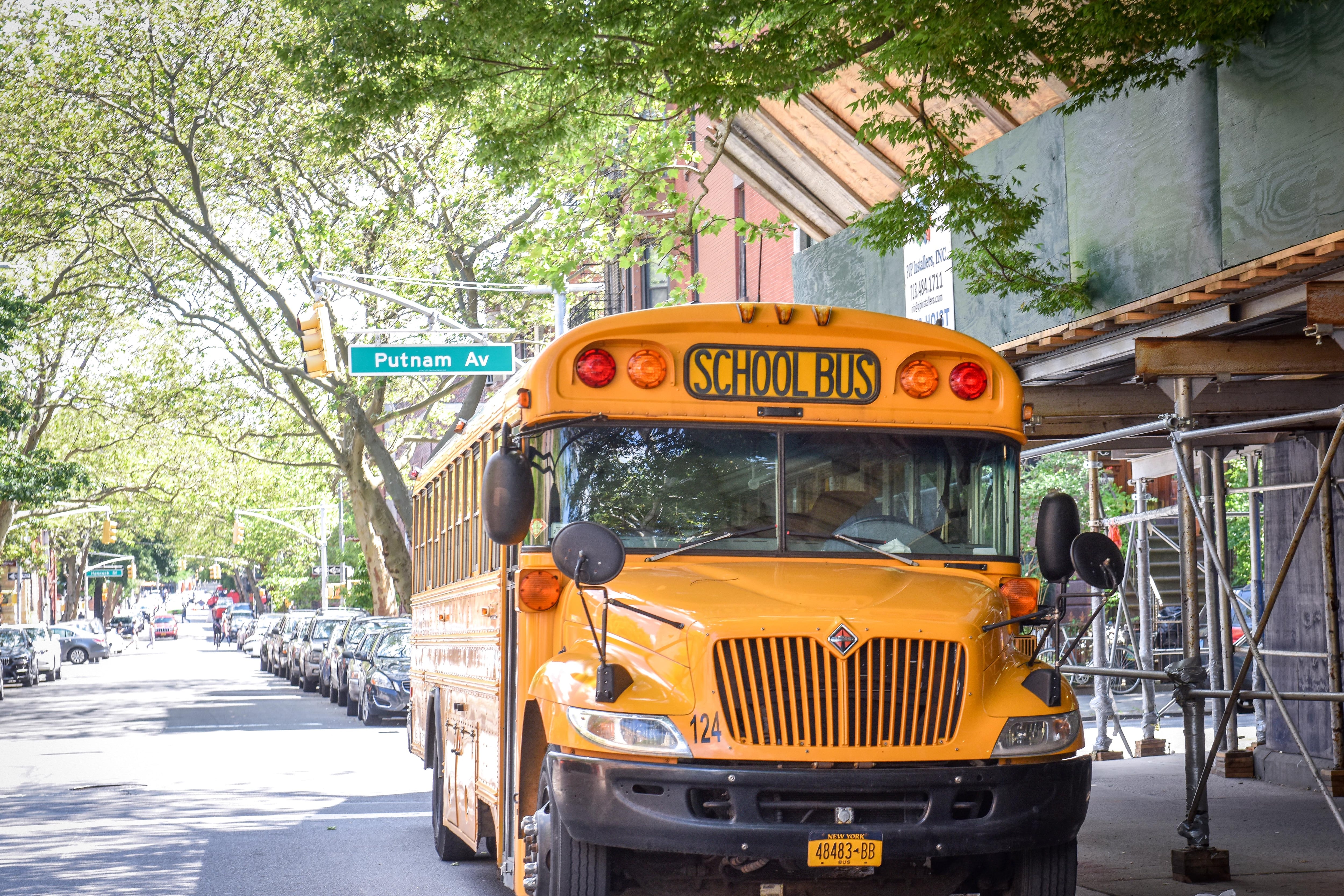 School bus outside Uncommon Schools Brooklyn East Collegiate Charter School, at 832 Marcy Ave., in Crown Heights, Brooklyn. Photo by David Handschuh/Chalkbeat; Taken May, 2019