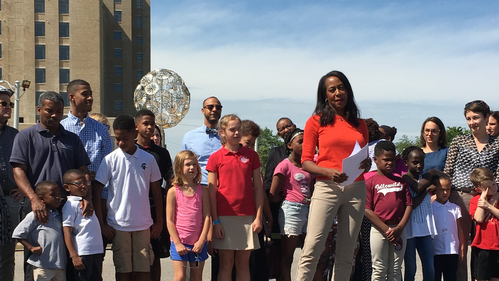Michelle McKissack, a board member of Crosstown High School Inc., speaks in May with supporters of the proposed new high school for midtown Memphis.