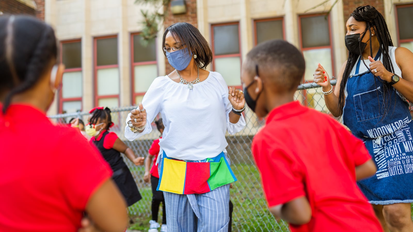 Educators and students celebrate the first day of school at Paul Robeson Malcom X Academy.