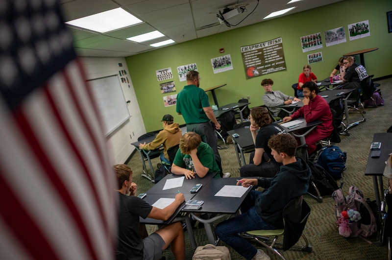 The flag hangs above a classroom.