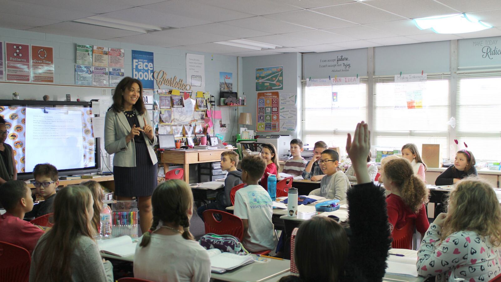 Penny Schwinn talks with students in Rutherford County at one of more than 175 classrooms she's visited since starting as Tennessee's education commissioner in February. (Photo courtesy of the Tennessee Department of Education)