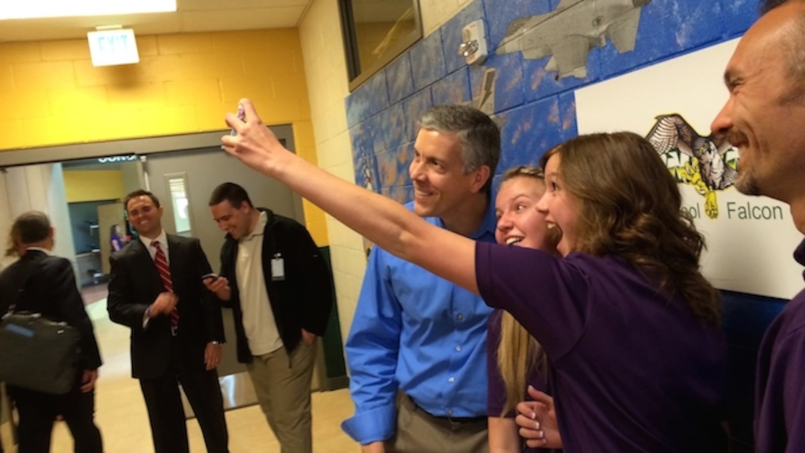 U.S. Secretary of Education Arne Duncan takes a selfie with students from Falcon High School. The students participated in a panel with Duncan on the unique needs of students with family in the military.